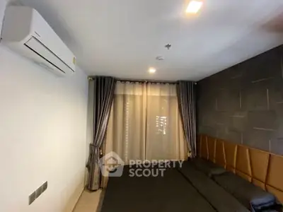 Modern bedroom with air conditioning and elegant curtains