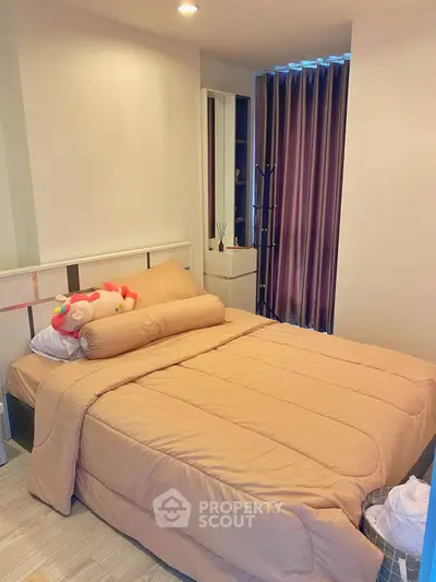 Cozy bedroom with plush bedding and modern decor, perfect for relaxation and comfort.