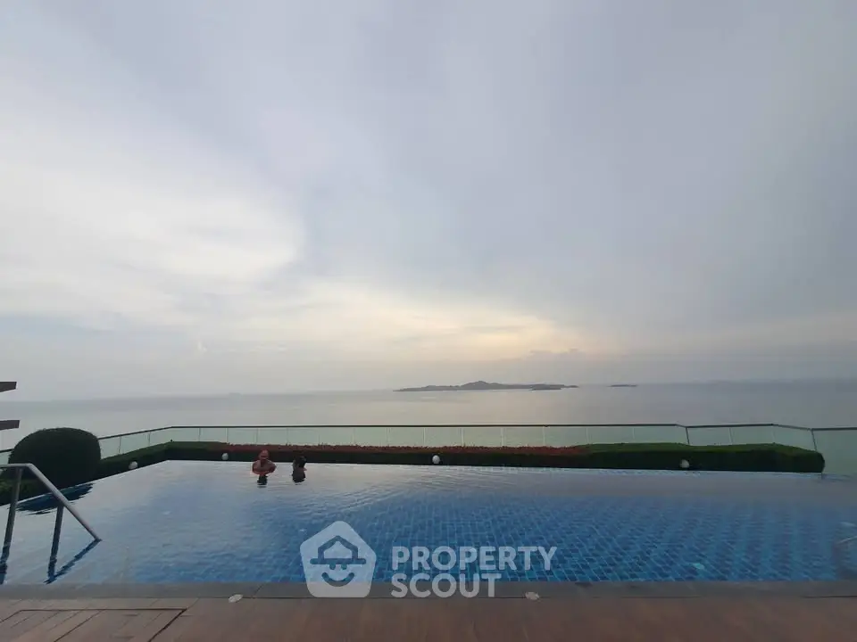 Stunning infinity pool with breathtaking ocean view at sunset