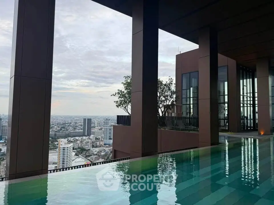 Luxurious rooftop pool with stunning city skyline view, perfect for urban living enthusiasts.