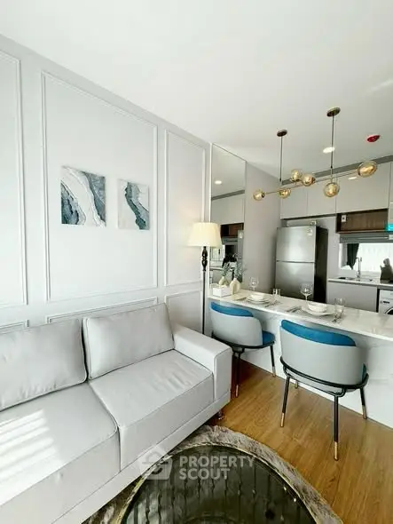 Modern living room with stylish decor and open kitchen layout