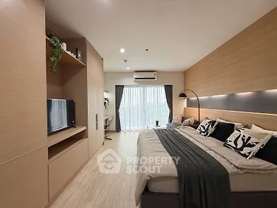 Modern bedroom with stylish decor and natural light