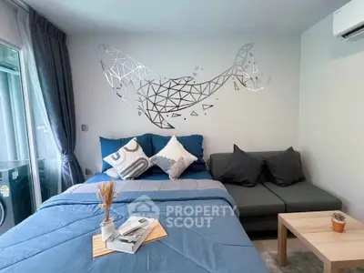 Modern bedroom with stylish decor and cozy seating area, perfect for relaxation and comfort.