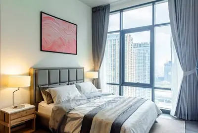 Luxurious bedroom with stunning city view and modern decor