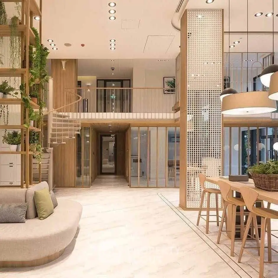 Modern open-plan living space with stylish decor and mezzanine level, featuring natural wood accents and ample lighting.
