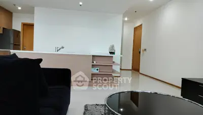 Modern open-plan living room with sleek furniture and minimalist design