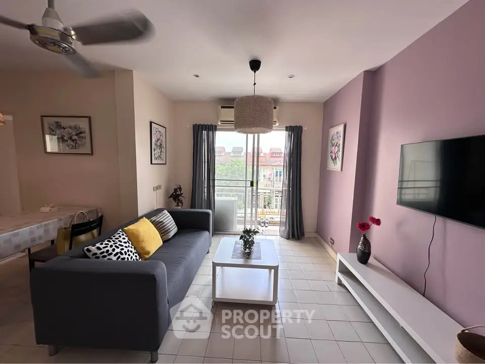 Modern living room with stylish decor and balcony view