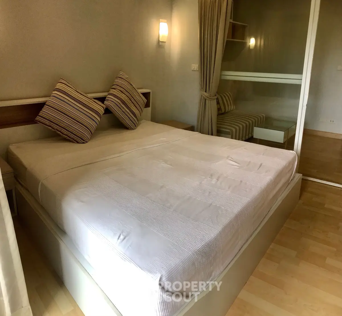 Cozy bedroom with modern decor and ample natural light