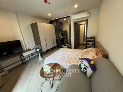 Cozy studio apartment with modern furnishings and air conditioning, perfect for urban living.