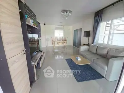 Spacious modern living room with sleek furniture and natural light