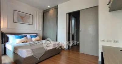 Modern bedroom with stylish decor and wooden flooring