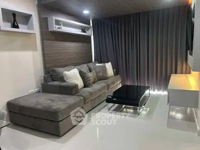 Modern living room with sleek gray sofa and stylish decor