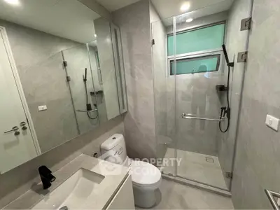 Modern bathroom with glass shower and sleek fixtures