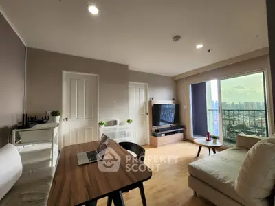 Modern living room with city view, featuring sleek furniture and natural light for a cozy ambiance.