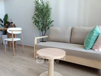 Modern living room with stylish furniture and indoor plants