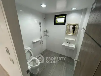 Modern bathroom with sleek fixtures and elegant tile flooring
