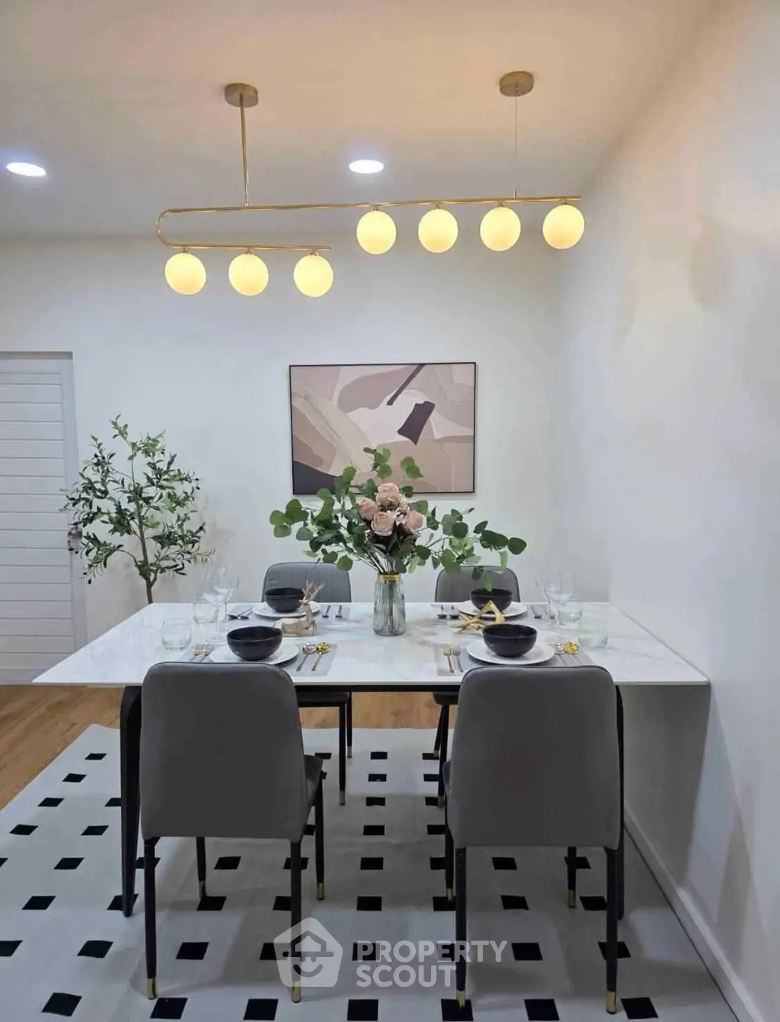 Elegant dining area with modern lighting and stylish decor
