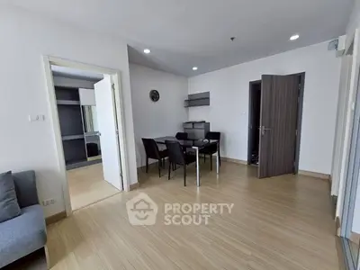 Spacious modern living room with dining area and sleek wooden flooring