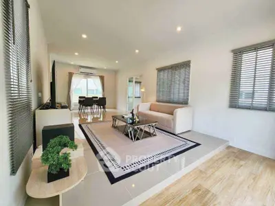 Spacious modern living room with elegant decor and natural light