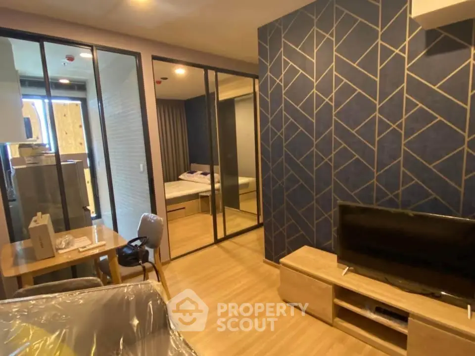 Modern apartment interior with stylish decor and open layout, featuring a cozy living area and bedroom.