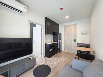 Modern living room with sleek kitchen in open layout apartment