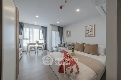 Modern studio apartment with cozy living area and stylish decor