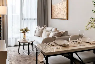 Elegant living room with cozy dining area, modern decor, and natural light.