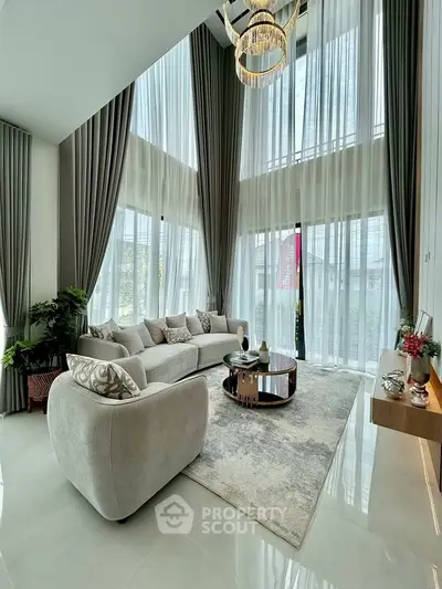 Luxurious living room with high ceilings and elegant decor