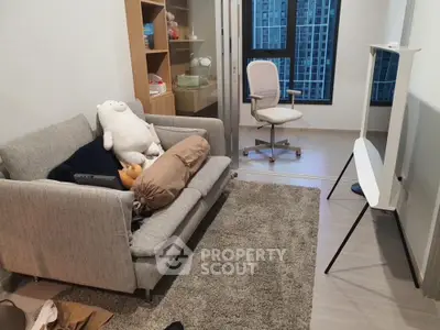 Modern study room with cozy sofa and office chair in high-rise apartment