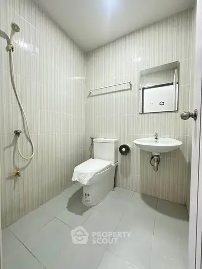 Modern bathroom with sleek fixtures and minimalist design, perfect for a contemporary home.