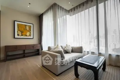 Elegant living room with city view, featuring a cozy sofa and modern decor.