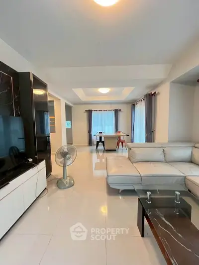 Spacious modern living room with elegant furniture and natural light