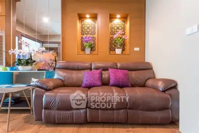 Luxurious living room with plush leather sofa and elegant decor accents