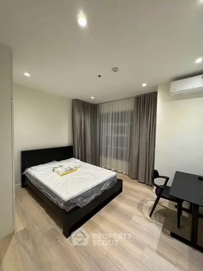 Modern bedroom with sleek furniture and natural light