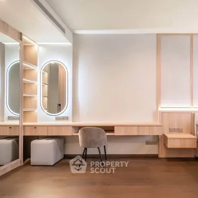 Modern study room with elegant wooden desk and stylish chair, featuring built-in shelves and ambient lighting.