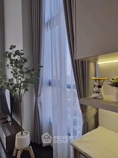 Modern living room with tall windows and elegant decor