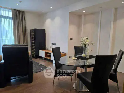 Modern living room with elegant dining area and stylish furniture