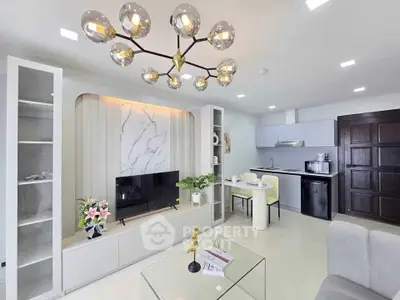Modern open-plan living room with stylish decor and integrated kitchen area.