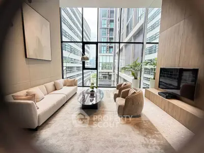 Luxurious modern living room with floor-to-ceiling windows and stunning city view.