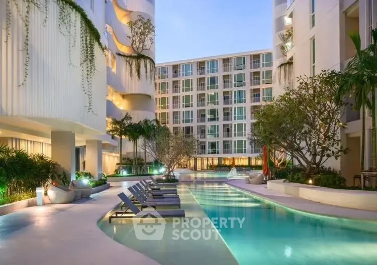 Luxurious apartment complex with stunning pool and modern architecture