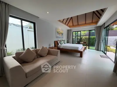 Spacious bedroom with garden view and modern decor
