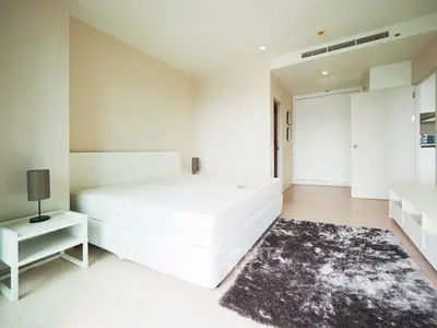 Spacious modern bedroom with minimalist design and cozy ambiance