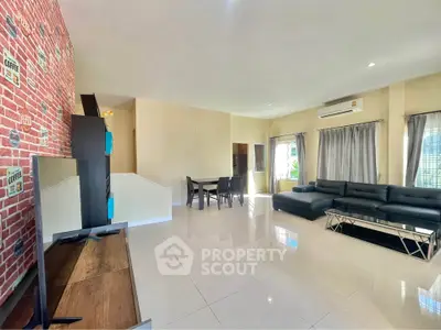 Spacious modern living room with stylish decor and ample natural light