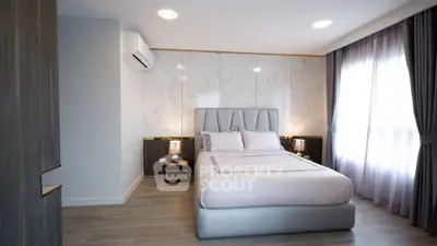 Modern bedroom with elegant decor and natural light