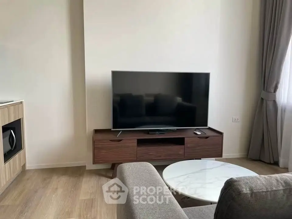 Modern living room with sleek TV setup and stylish furniture