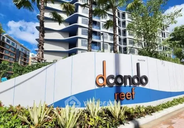 Modern condominium exterior with lush landscaping and stylish signage at dcondo reef.
