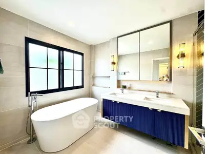 Luxurious modern bathroom with freestanding bathtub and double vanity