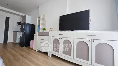 Modern living room with stylish furniture and sleek appliances in a contemporary apartment.