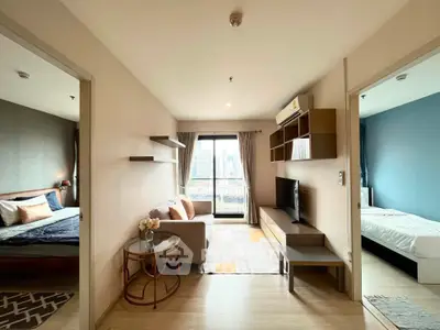 Modern apartment interior with cozy living room and two bedrooms, featuring stylish decor and city view.