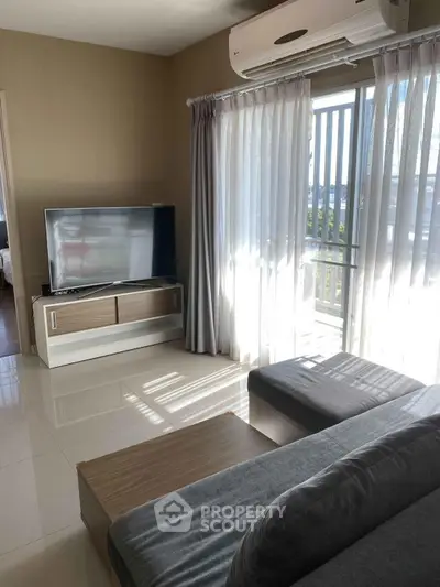 Modern living room with sleek furniture and large window for natural light